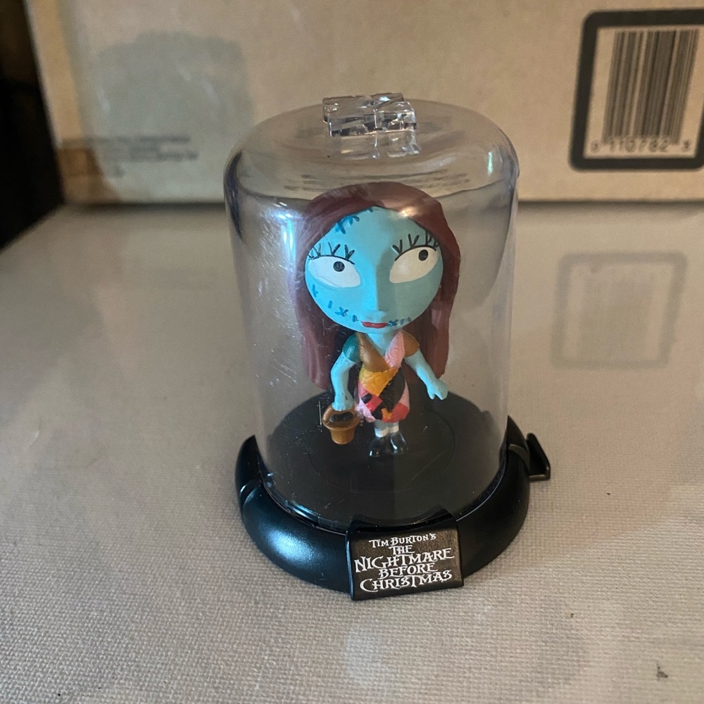 Source Unknown Blue-and-Red Patchwork Doll in Display Dome